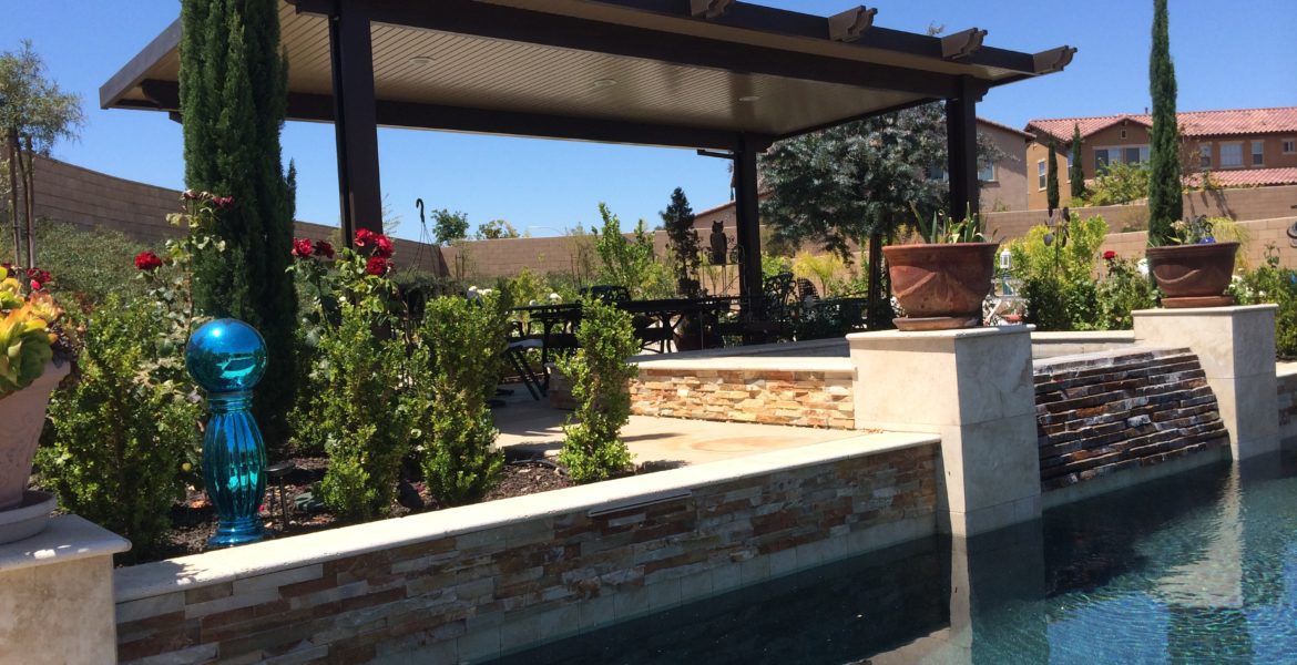 Modern black aluminum pergola structure against clear blue sky